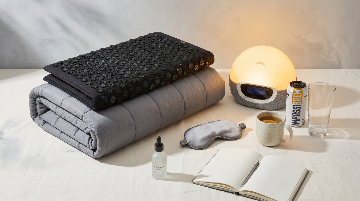 Stress relief products including weighted blanket, acupressure mat, sunrise light, journal and IMPOSSIBREW alcohol-free beer
