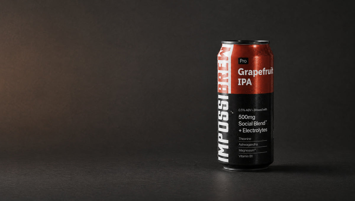 IMPOSSIBREW Pro Grapefruit IPA can with a black lid on a dark studio surface