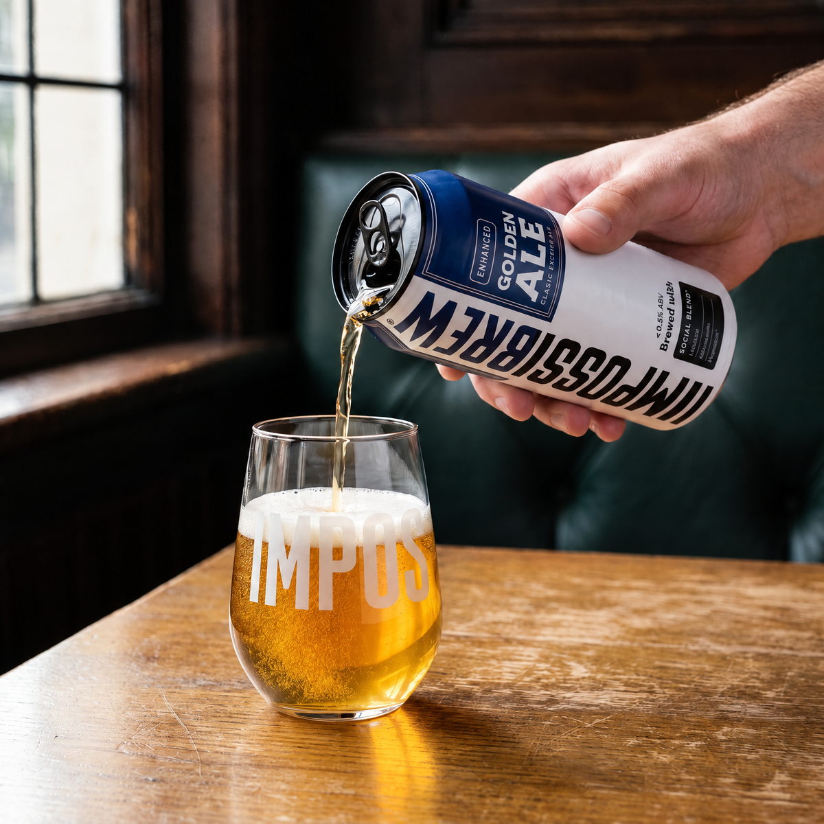 Golden Ale mid-pour into the Signature Glass beside an English pub window